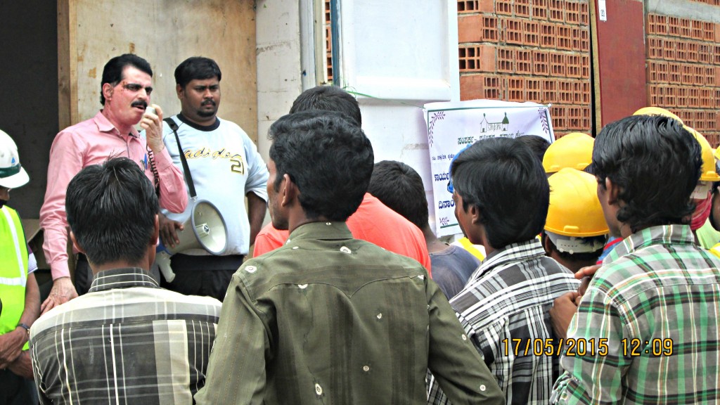 Dr Sudhakar briefs migrant construction workers about general health and hygiene. 